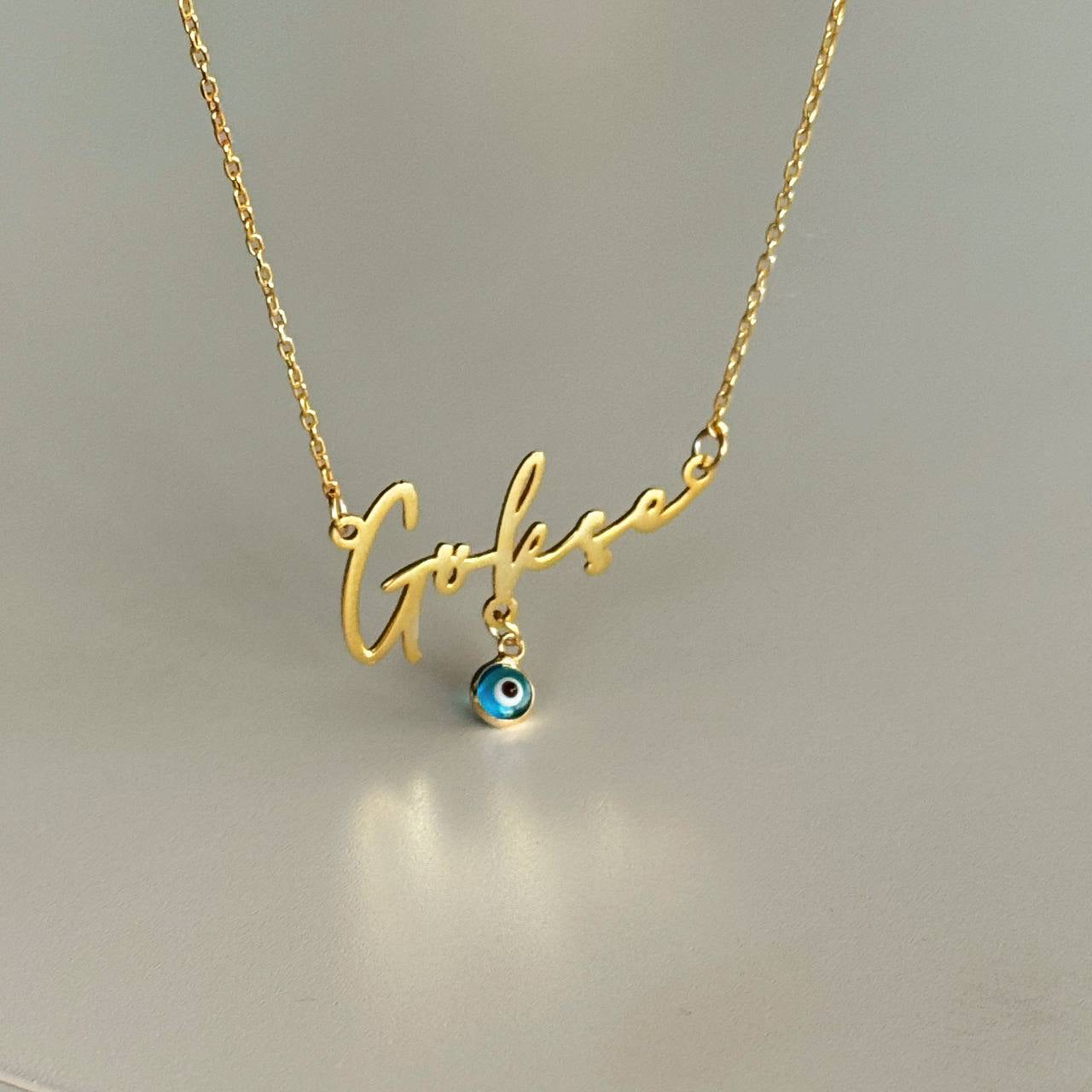 HORIZONTAL NAME NECKLACE WITH NAZAAR DANGLE | 925 SILVER GOLD PLATED